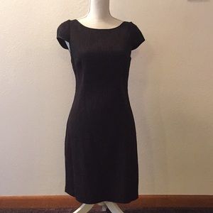 A black A-line dress.